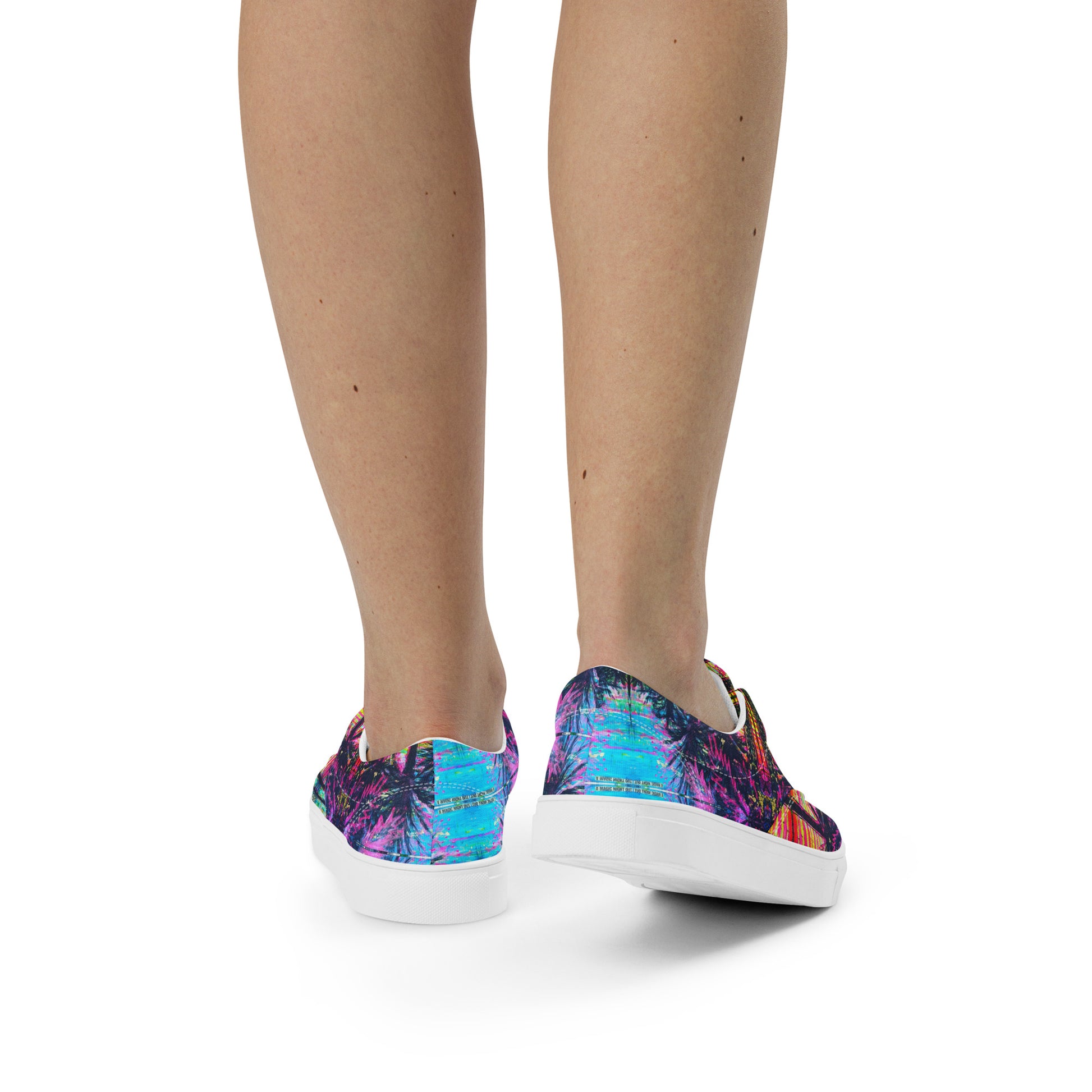 Front view of white canvas shoes showing the detailed Vicky Steane Barcelona printed artwork design
