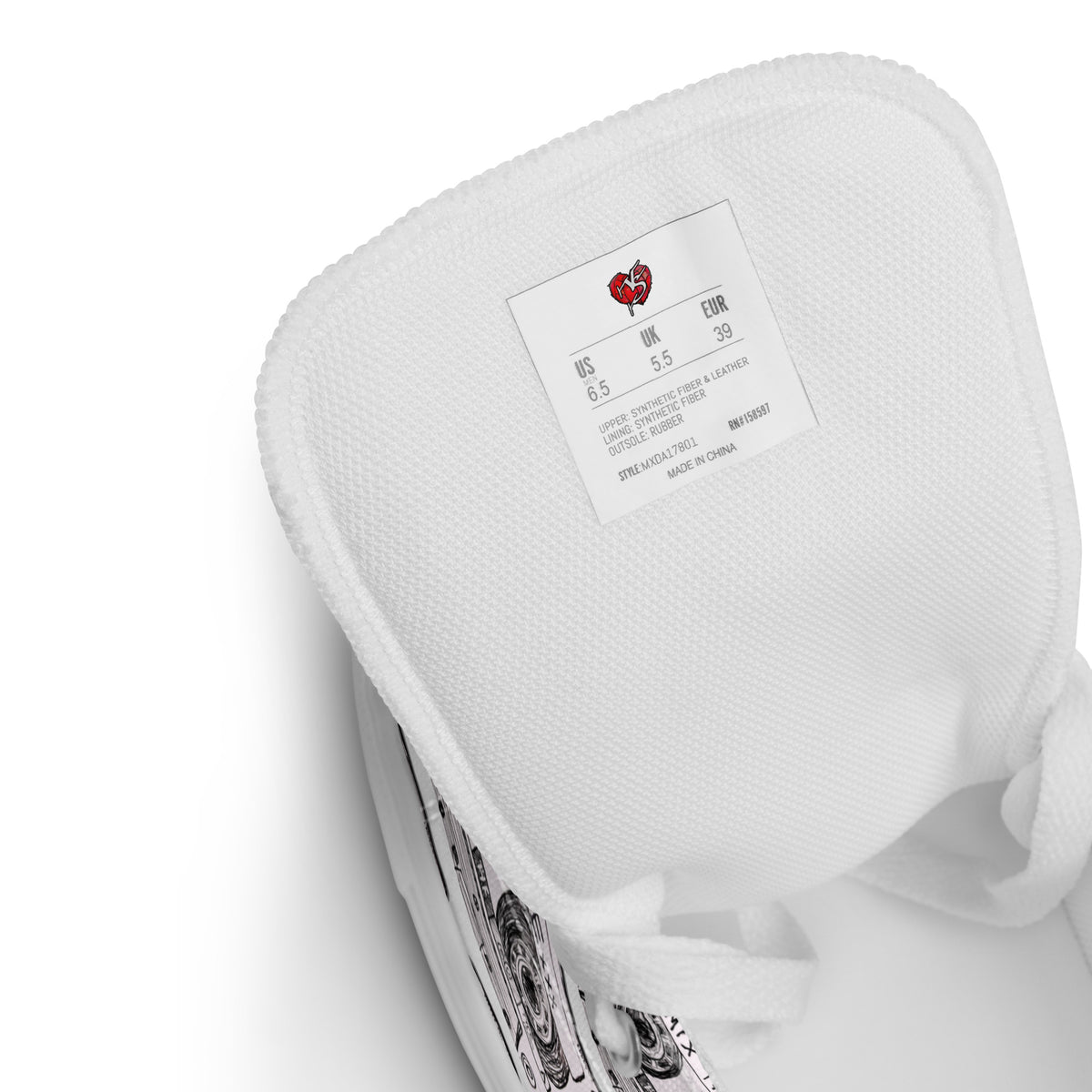 A close-up of a Mix Tape High Top Canvas Shoes textured shoe cushion or insert with a white paper label showing  Vicky Steane Apparel Heart logo, size and weight details, photographed on a white background.