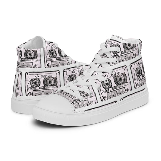 A pair of Vicky Steane's Mix Tape white high-top sneakers featuring a black line-art print of cassette tapes, shown against a plain white background.