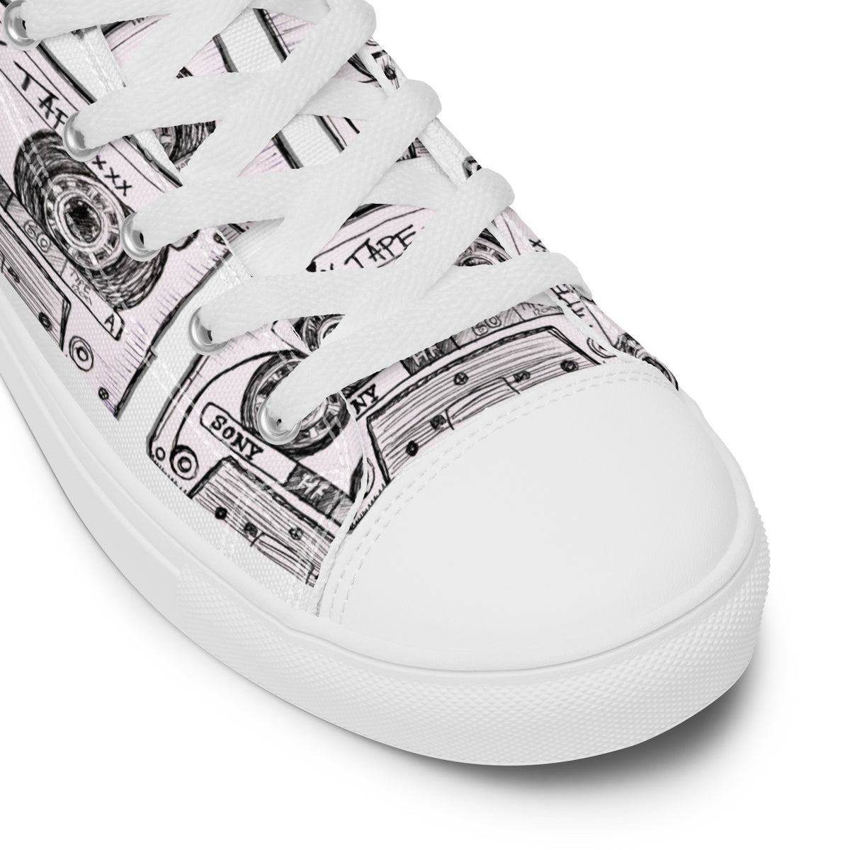 A close-up of a  Vicky Steane's Mix Tape High Top Canvas Shoes featuring a black and white graphic print of cassette tapes, with white laces and a white rubber sole.