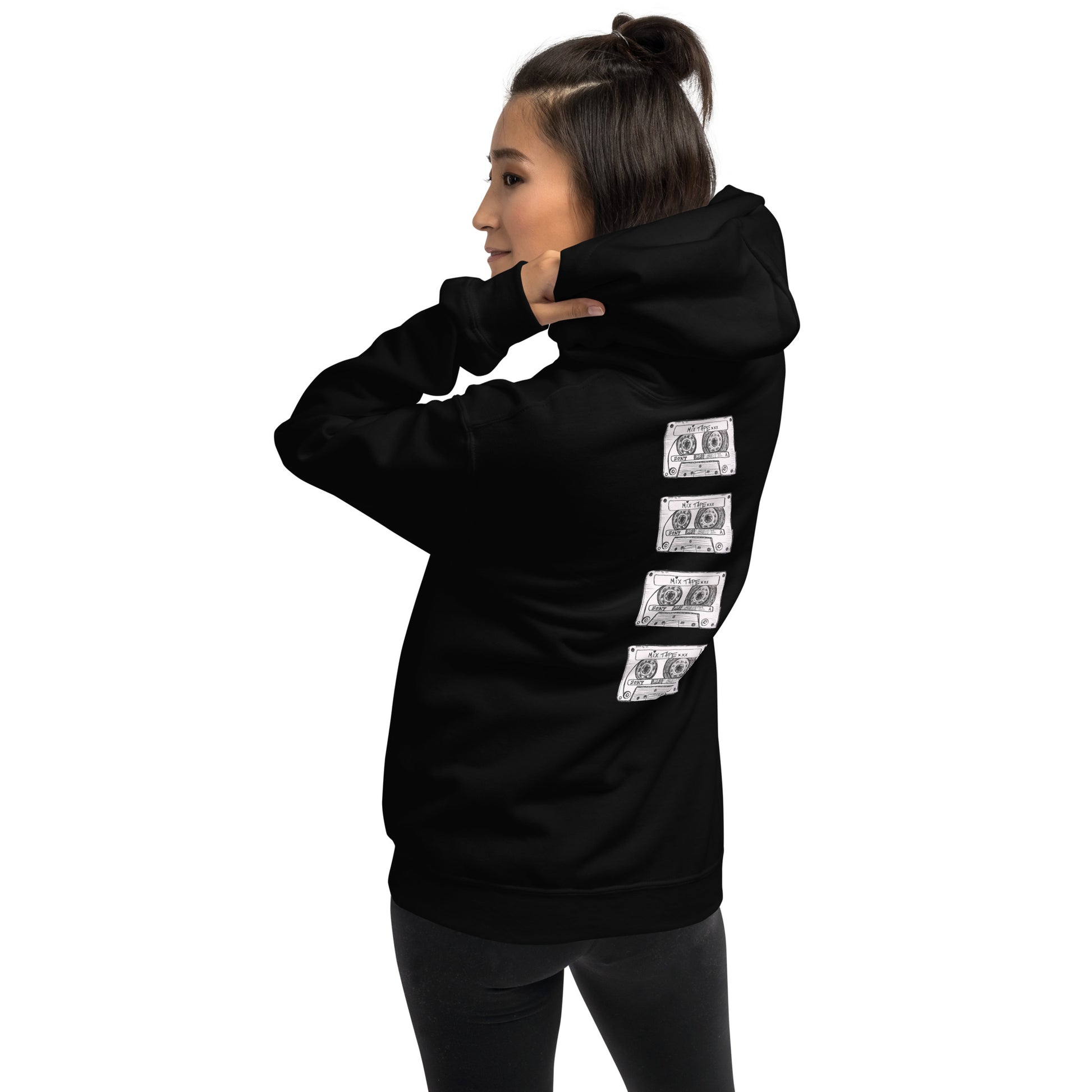 Model wearing the black Mix Tape oversized hoodie with cassette artwork on the back