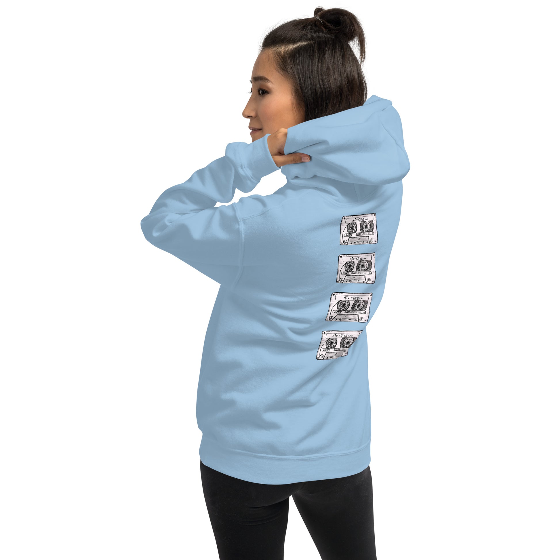 Model wearing light blue Mix Tape oversized hoodie with cassette artwork on the back